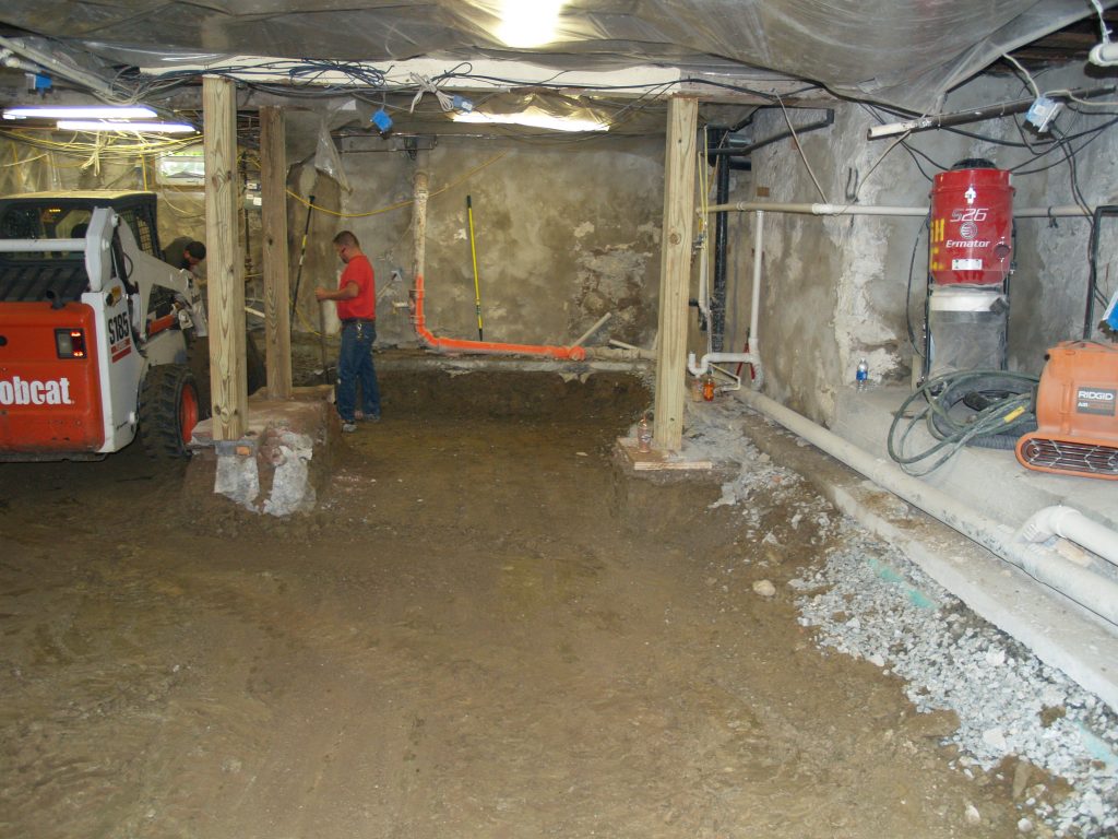 Bobcat Machine in the Basement of remodel project in Belmont MA