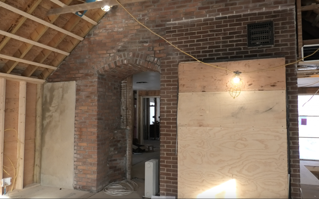 Jensen Hus contemporary kitchen design with some exposed brickwork